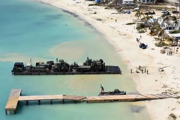 A UK Royal Logistics Corp landing raft delivers emergency relief to Anguilla