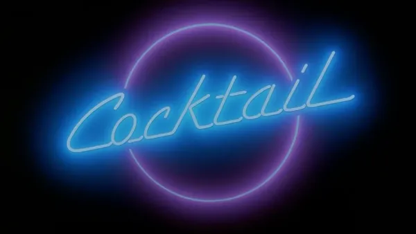 The title card for the film Cocktail. It is a bright neon sign with blue writing saying Cocktail surrounded by a pink ring