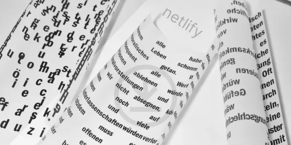 Three rolled up pieces of paper have scattered text in various font faces. In the foreground is a faint outline of a download icon.