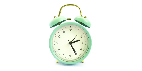 An analog limegreen clock against a stark white background. It has The Matrix vibes.